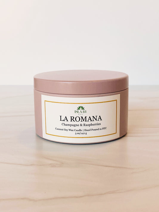 La Romana Signature Travel Tin Scented Candle; Mauve tin with white label and green logo; Coconut Soy Wax and Wood Wick; Dominican Candles; Dominican Republic; Caribbean; Tropical; Hispanic candles; Latino candles; Travel; Tourism; Best Dominican Candles; Dominican Candle Company
