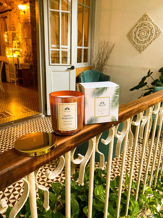 isla 84 NYC Santo Domingo candle with tropical decor and music playlist.