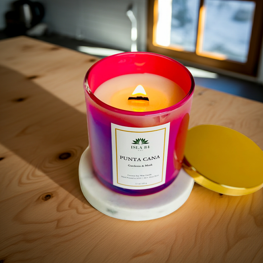 Isla 84 NYC Punta Cana Candle lit on a wooden counter