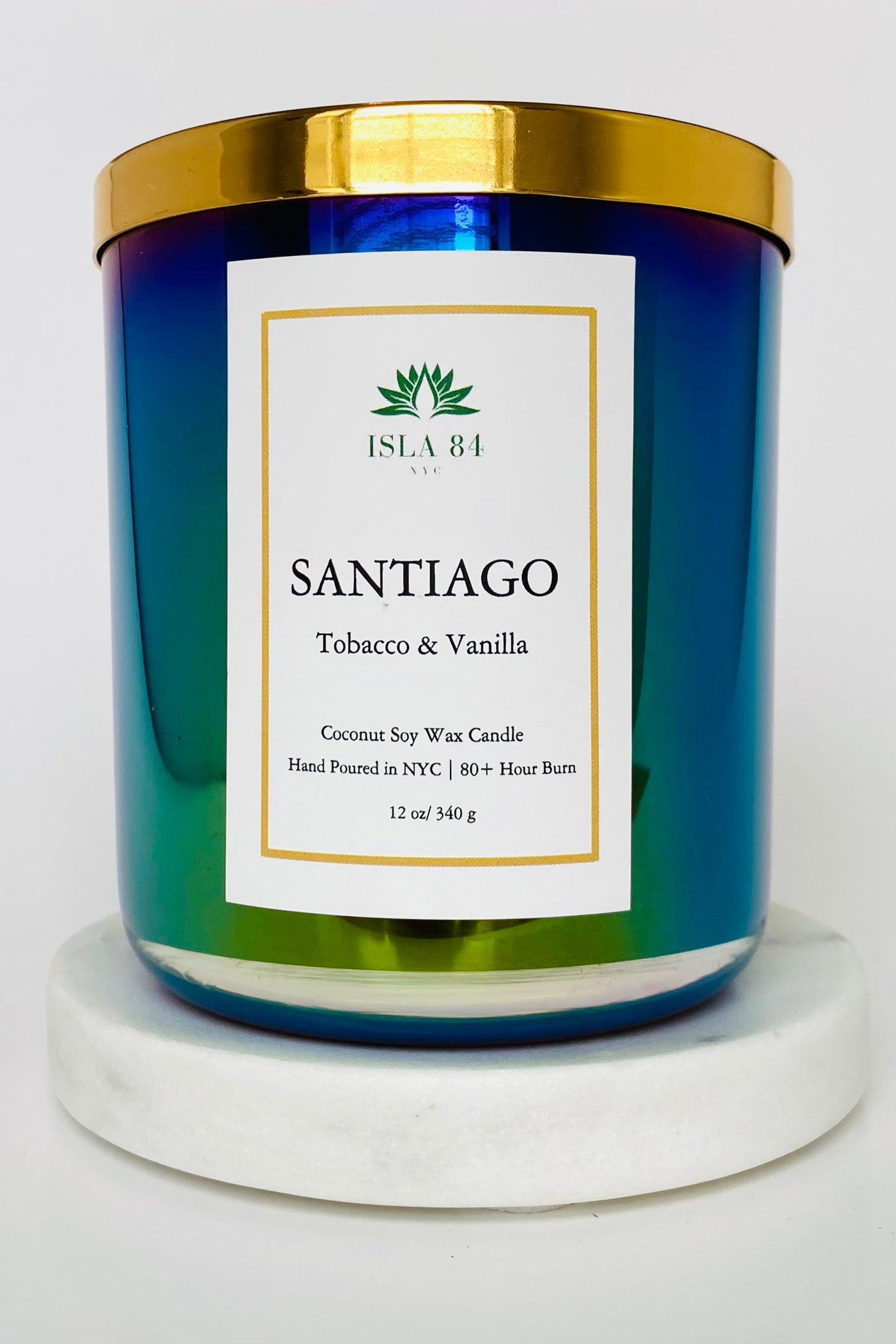 Santiago Signature Scented Candle; Tobacco & Vanilla; Iridescent Black, green vessel; White label with green logo; Dominican Republic Candels; DR Candles; Coconut Soy Wax Candle with Wood Wick; Shiny Gold Lid