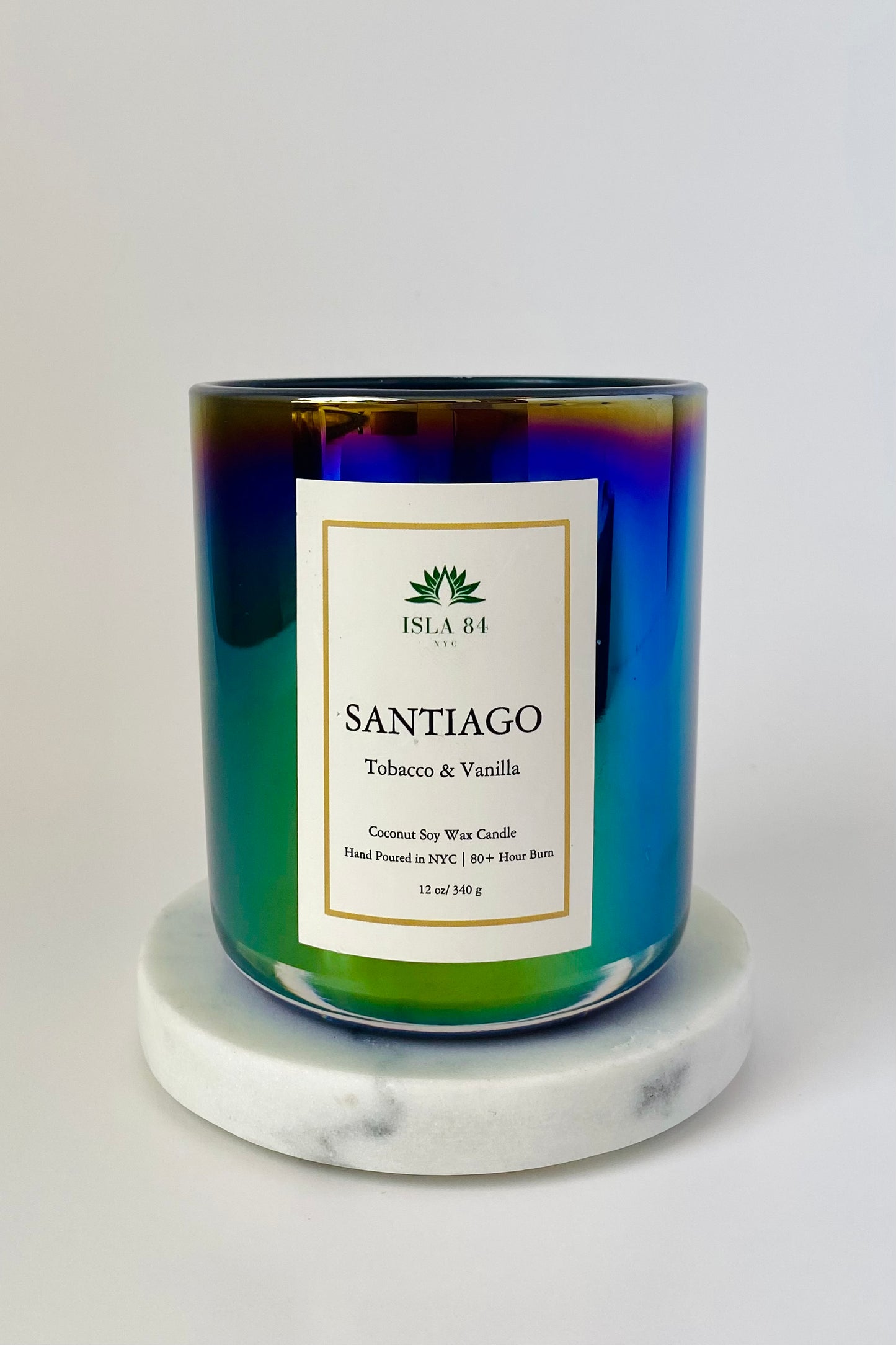 Santiago de los Caballeros Signature Scented Candle; Tobacco & Vanilla; Iridescent Black, green vessel; White label with green logo; Dominican Republic Candels; DR Candles; Coconut Soy Wax Candle with Wood Wick