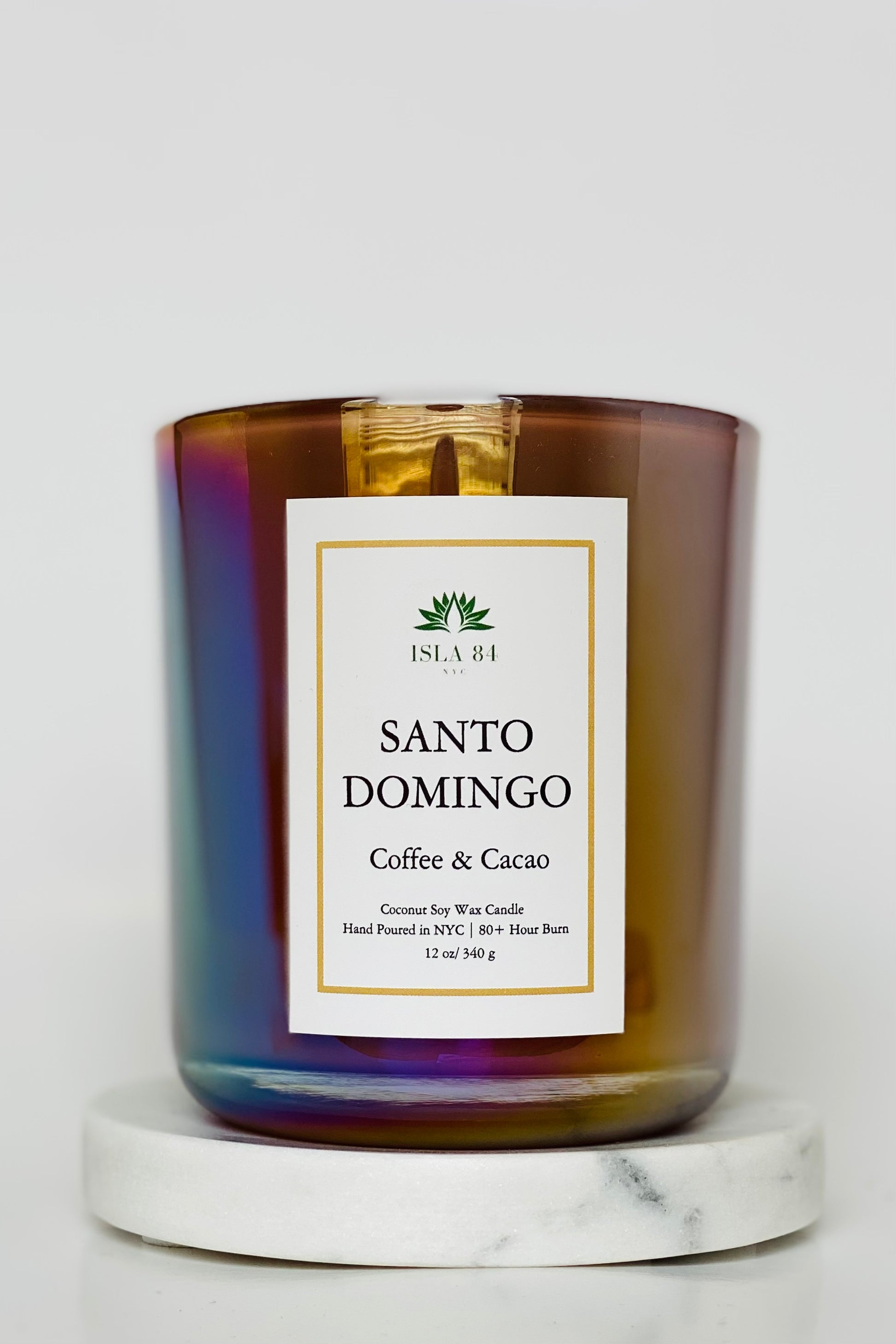Santo Domingo Scented Candle; Santo Domingo; Saint Sunday; Dominican Republic Candles; DR Candles; Quisqueya Candles; Velas aromaticas; Coconut Soy Wax Candles; Iridescent Brown Vessel with White label and green logo